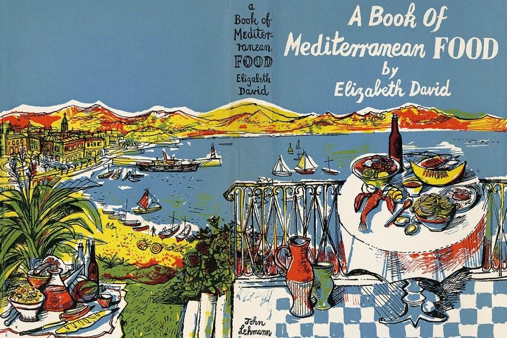 A book cover showing a table laden with food sat above a sweeping Mediterranean bay