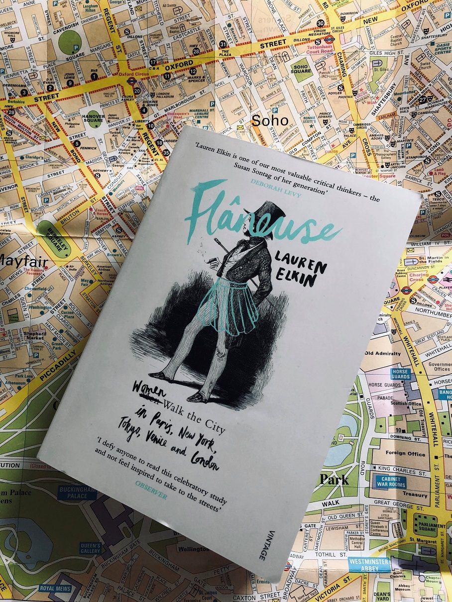 Photograph of the book Flaneuse by Lauren Elkin against a map of London.