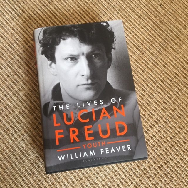 A photograph of The Lives of Lucian Freud by William Feaver against a carpet background.
